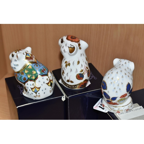 407 - THREE BOXED ROYAL CROWN DERBY PAPERWEIGHTS, comprising Royal Crown Derby Collectors Guild 'Derby Dor... 