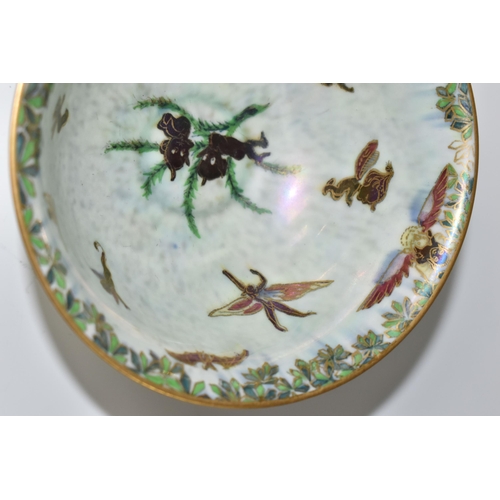 420 - A WEDGWOOD FAIRYLAND LUSTRE FOOTED BOWL,  decorated with a mother of pearl lustre with fairies in va... 