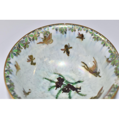 420 - A WEDGWOOD FAIRYLAND LUSTRE FOOTED BOWL,  decorated with a mother of pearl lustre with fairies in va... 