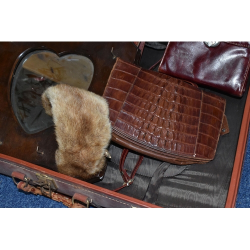 432 - A BROWN TRAVELLING TRUNK, containing two brown leather school satchels (one monogrammed), a brown cr... 