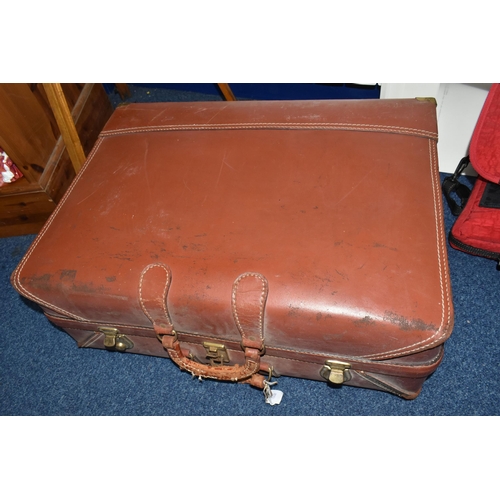 432 - A BROWN TRAVELLING TRUNK, containing two brown leather school satchels (one monogrammed), a brown cr... 