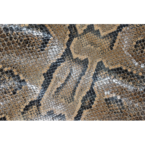 459 - A ROLLED SNAKE SKIN, possibly a python, length approximately 310cm in length and 50cm in width (Cond... 