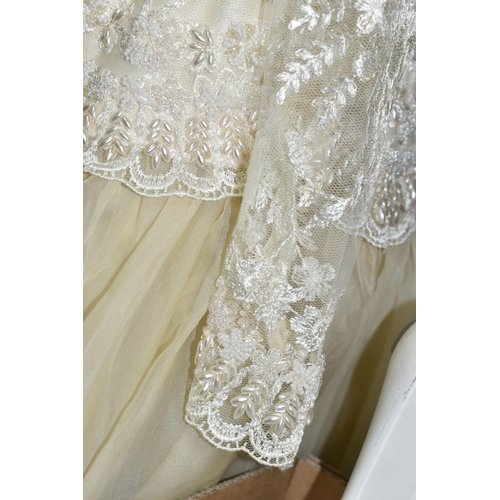 496 - A DROP WAISTED 1980's STYLE CREAM/CHAMPAGNE COLOURED WEDDING DRESS WITH TUILLE UNDERSKIRT, approxima... 