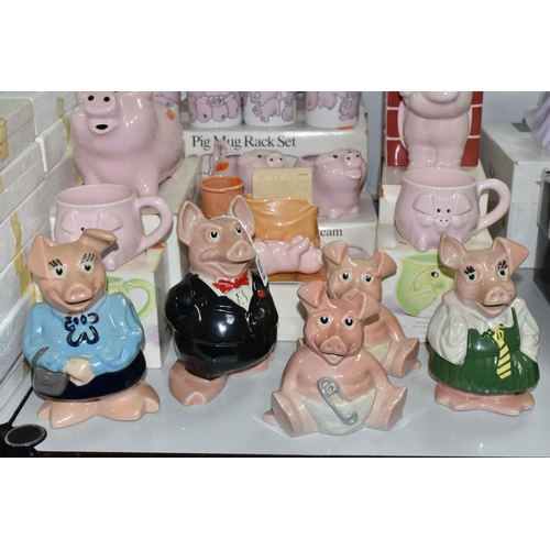 553 - A COLLECTION OF PIG THEMED CERAMICS, to include five Wade Nat West piggy banks: Sir Nathaniel (toe c... 