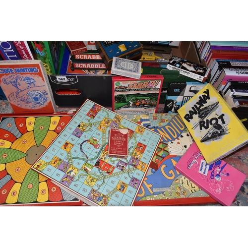 562 - TWO BOXES OF BOARD GAMES AND PLAYING CARDS, to include two sets of Scrabble, a Monopoly board, Capit... 