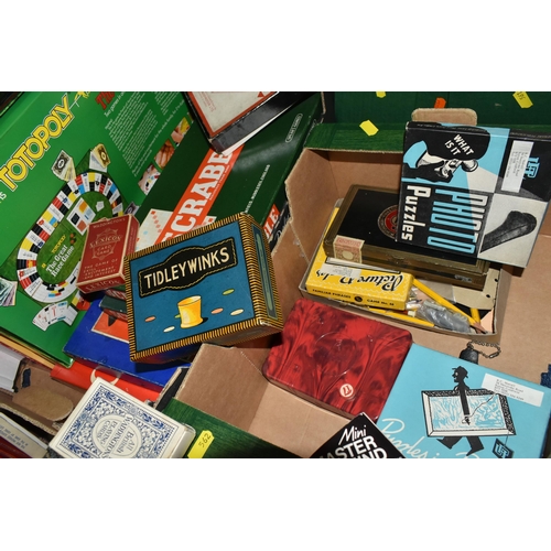 562 - TWO BOXES OF BOARD GAMES AND PLAYING CARDS, to include two sets of Scrabble, a Monopoly board, Capit... 