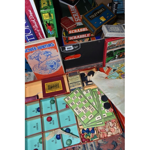 562 - TWO BOXES OF BOARD GAMES AND PLAYING CARDS, to include two sets of Scrabble, a Monopoly board, Capit... 