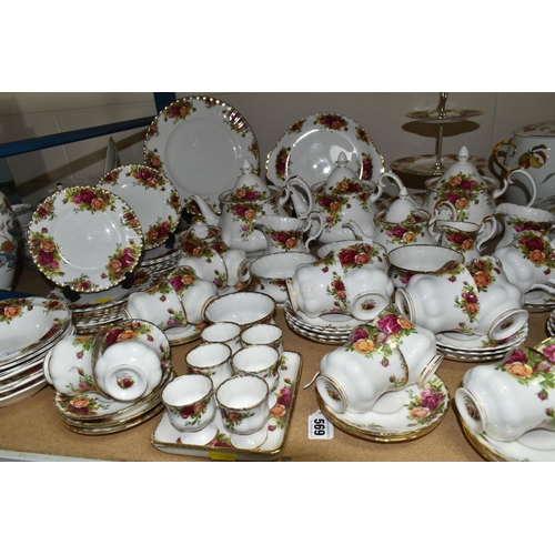 569 - A NINETY SIX PIECE ROYAL ALBERT 'OLD COUNTRY ROSES' DINNER SERVICE, comprising three large teapots (... 