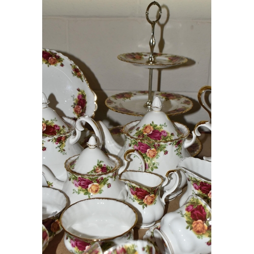 569 - A NINETY SIX PIECE ROYAL ALBERT 'OLD COUNTRY ROSES' DINNER SERVICE, comprising three large teapots (... 