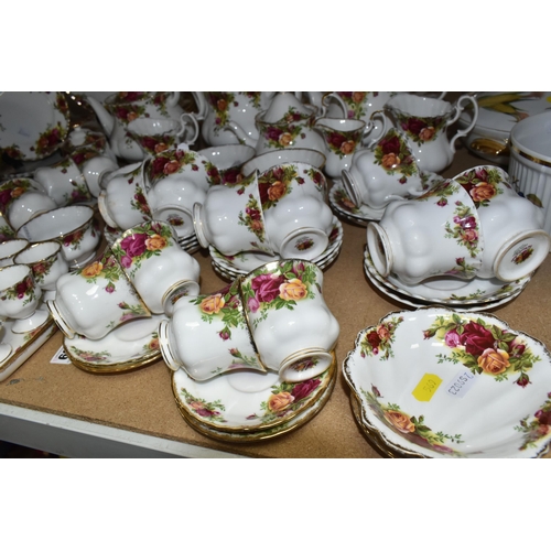 569 - A NINETY SIX PIECE ROYAL ALBERT 'OLD COUNTRY ROSES' DINNER SERVICE, comprising three large teapots (... 