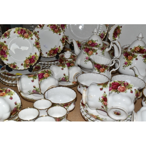 569 - A NINETY SIX PIECE ROYAL ALBERT 'OLD COUNTRY ROSES' DINNER SERVICE, comprising three large teapots (... 