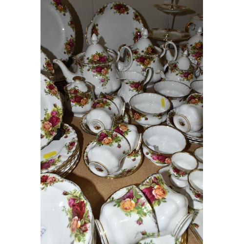 569 - A NINETY SIX PIECE ROYAL ALBERT 'OLD COUNTRY ROSES' DINNER SERVICE, comprising three large teapots (... 