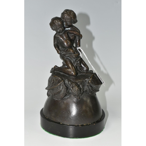 587 - A BRONZE FIGURE GROUP, depicting a mother and child kneeling on top of a mythical beast, loose on a ... 