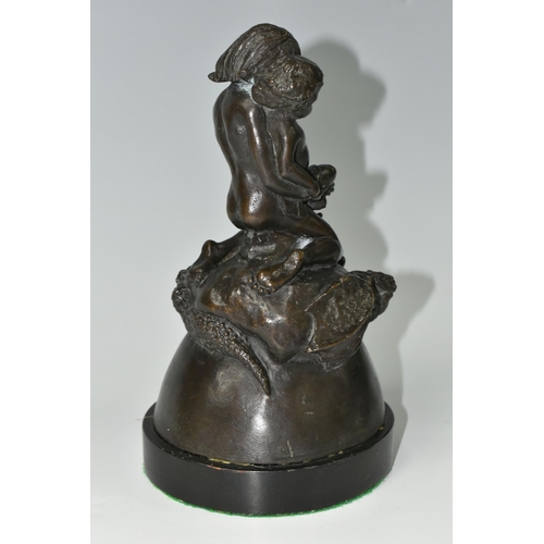 587 - A BRONZE FIGURE GROUP, depicting a mother and child kneeling on top of a mythical beast, loose on a ... 