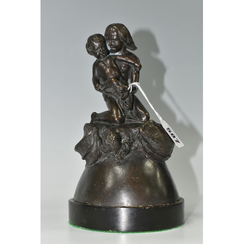 587 - A BRONZE FIGURE GROUP, depicting a mother and child kneeling on top of a mythical beast, loose on a ... 