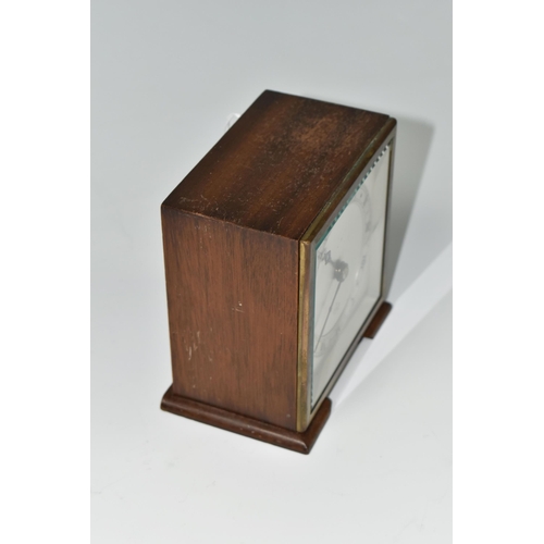 588 - A SMALL ELLIOTT MANTEL CLOCK, the case square in form, raised on two tapering feet, the dial marked ... 