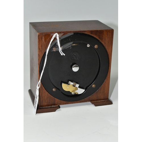 588 - A SMALL ELLIOTT MANTEL CLOCK, the case square in form, raised on two tapering feet, the dial marked ... 