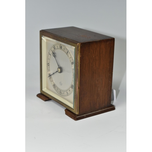 588 - A SMALL ELLIOTT MANTEL CLOCK, the case square in form, raised on two tapering feet, the dial marked ... 