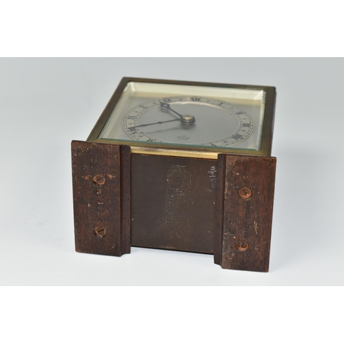 588 - A SMALL ELLIOTT MANTEL CLOCK, the case square in form, raised on two tapering feet, the dial marked ... 