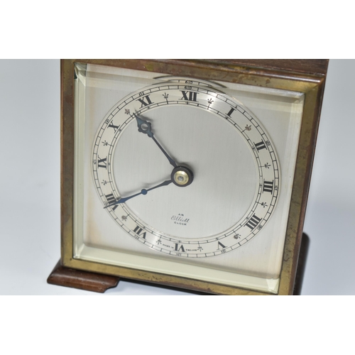 588 - A SMALL ELLIOTT MANTEL CLOCK, the case square in form, raised on two tapering feet, the dial marked ... 