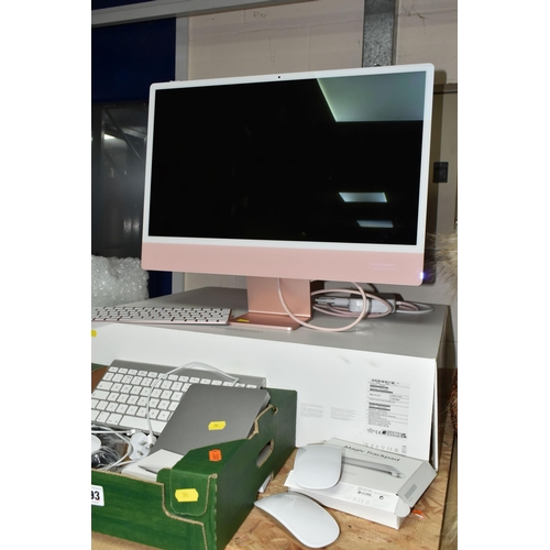 593 - A REFURBISHED 24 INCH APPLE iMAC COMPUTER WITH BOX, model number A2438, together with an Apple A3179... 