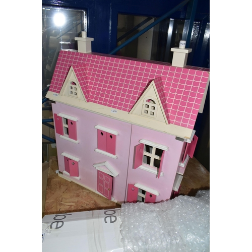 594 - A MODERN WOODEN DOLLS HOUSE, pink with white trim, front opening to reveal two rooms over two floors... 