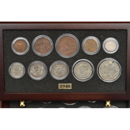 154 - A SMALL WOODEN COIN CABINET, consisting of eight drawers seven containing UK coinage from 1939-1945,... 