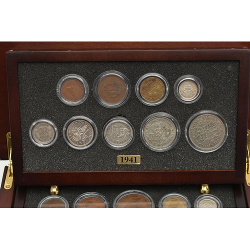 154 - A SMALL WOODEN COIN CABINET, consisting of eight drawers seven containing UK coinage from 1939-1945,... 