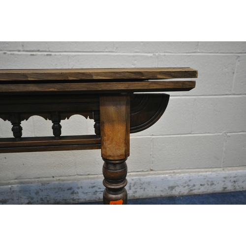 1203 - AN EDWARDIAN BURR WALNUT FOLD OVER CARD TABLE, the swivel top enclosing a green baize playing field ... 