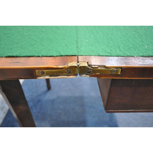 1204 - A GEORGIAN MAHOGANY FOLD OVER CARD TABLE, the top enclosing a green baize playing field, raised on s... 