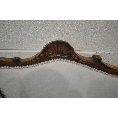 1208 - A VICTORIAN MAHOGANY SOFA, one side of backrest higher than the other, with a scrolled crest, closed... 