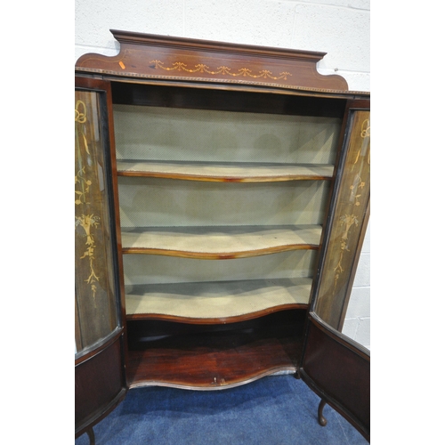 1210 - AN EDWARDIAN WALNUT AND INLAID SERPENTINE DISPLAY CABINET, the double glazed doors enclosing two she... 