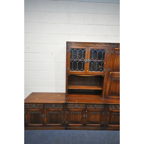 1231 - AN OLD CHARM WALL CABINET, each base fitted with two drawers, above double cupboard doors, two top s... 