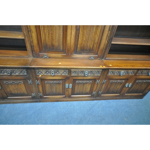 1231 - AN OLD CHARM WALL CABINET, each base fitted with two drawers, above double cupboard doors, two top s... 