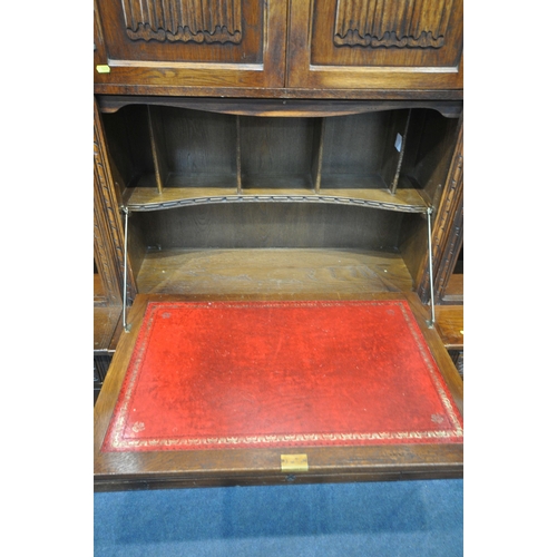 1231 - AN OLD CHARM WALL CABINET, each base fitted with two drawers, above double cupboard doors, two top s... 