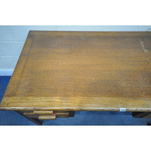 1232 - A 20TH CENTURY OAK DESK, fitted with three drawers, width 138cm x depth 77cm x height 77cm, along wi... 