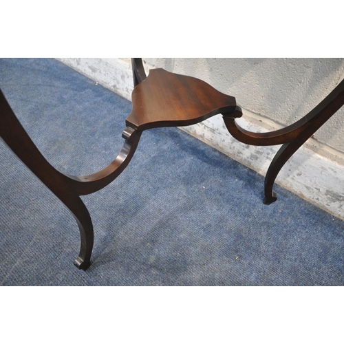 1237 - AN EDWARDIAN MAHOGANY SERPENTINE BIJOUTERIE TABLE, of a triangular form, with a hinged lid, beige ve... 