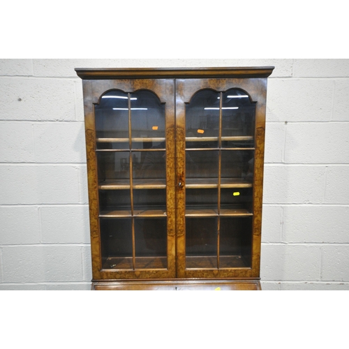 1239 - A 20TH CENTURY WALNUT BUREAU BOOKCASE, the top with double glazed doors, enclosing three shelves, at... 