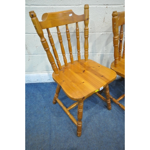 1251 - A SET OF FOUR PINE SPINDLE BACK KITCHEN CHAIRS (condition report: slight wobble to a couple of back ... 