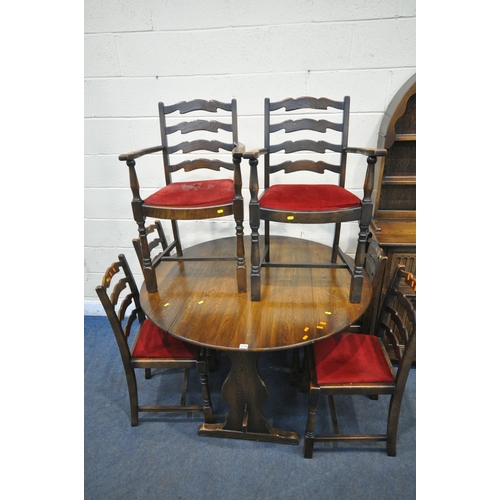 1258 - A 20TH CENTURY OAK DROP LEAF TABLE, raised on trestle legs, united by a stretcher, diameter 122cm x ... 