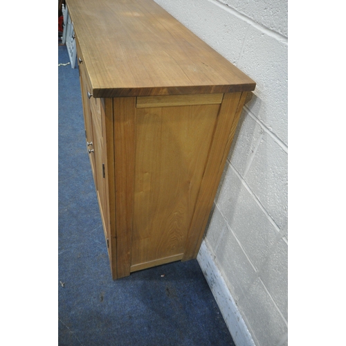 1272 - A MODERN SOLID OAK SIDEBOARD, fitted with three drawers, above double cupboard doors, length 110cm x... 