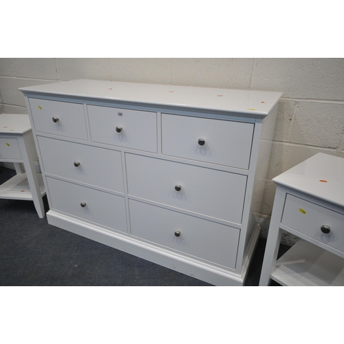 1281 - A MODERN WHITE FINISH SIDEBOARD / CHEST OF SEVEN DRAWERS, width 127cm x depth 47cm x height 87cm, an... 