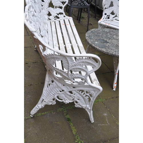 1011 - A LATE 20TH CENTURY CAST ALUMINIUM GARDEN SET comprising of a three seat bench and two matching chai... 