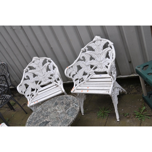 1011 - A LATE 20TH CENTURY CAST ALUMINIUM GARDEN SET comprising of a three seat bench and two matching chai... 