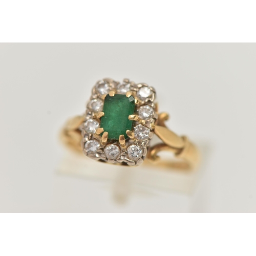 24 - A YELLOW METAL EMERALD AND DIAMOND CLUSTER RING, of a rectangular form, set to the centre with an em... 