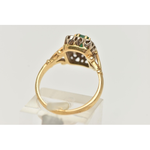 24 - A YELLOW METAL EMERALD AND DIAMOND CLUSTER RING, of a rectangular form, set to the centre with an em... 