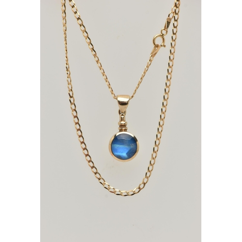 27 - A 9CT GOLD GEM SET PENDANT AND CHAIN, the circular pendant set with a blue sheen cabochon, possibly ... 