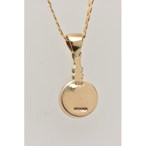 27 - A 9CT GOLD GEM SET PENDANT AND CHAIN, the circular pendant set with a blue sheen cabochon, possibly ... 