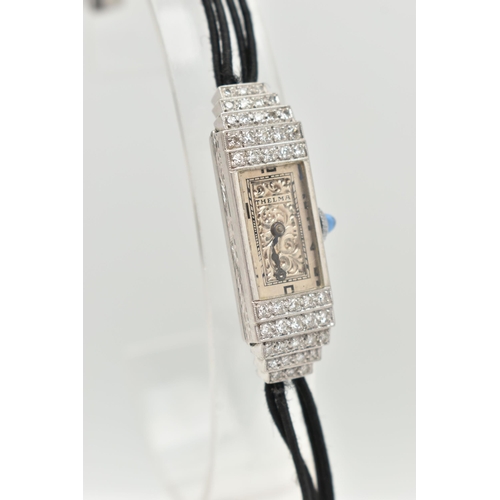 29 - A LADIES DIAMOND SET COCKTAIL WATCH, manual wind watch, rectangular silver scrolling dial, signed 'T... 