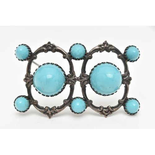 30 - A WHITE METAL BROOCH, open work brooch set with two large blue ceramic domes and six smaller domes, ... 